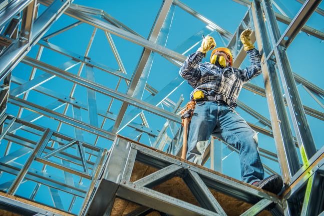 RAM Steel worker installing steel framing on a construction site