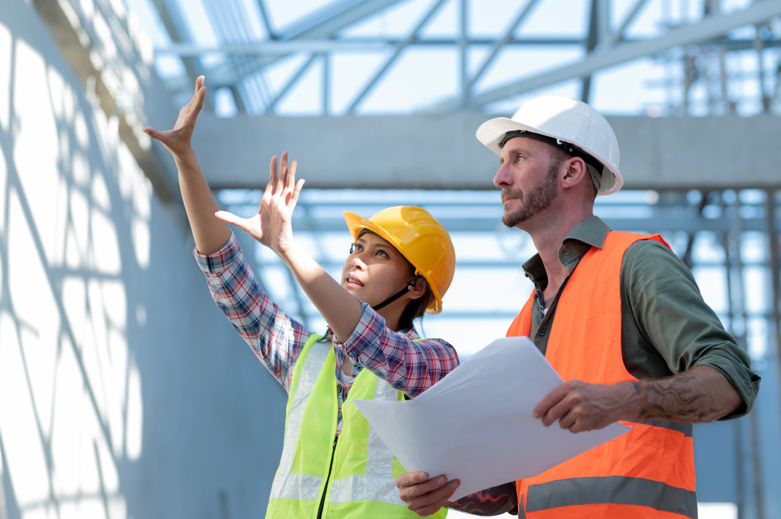 RAM Steel engineers reviewing plans on a job site
